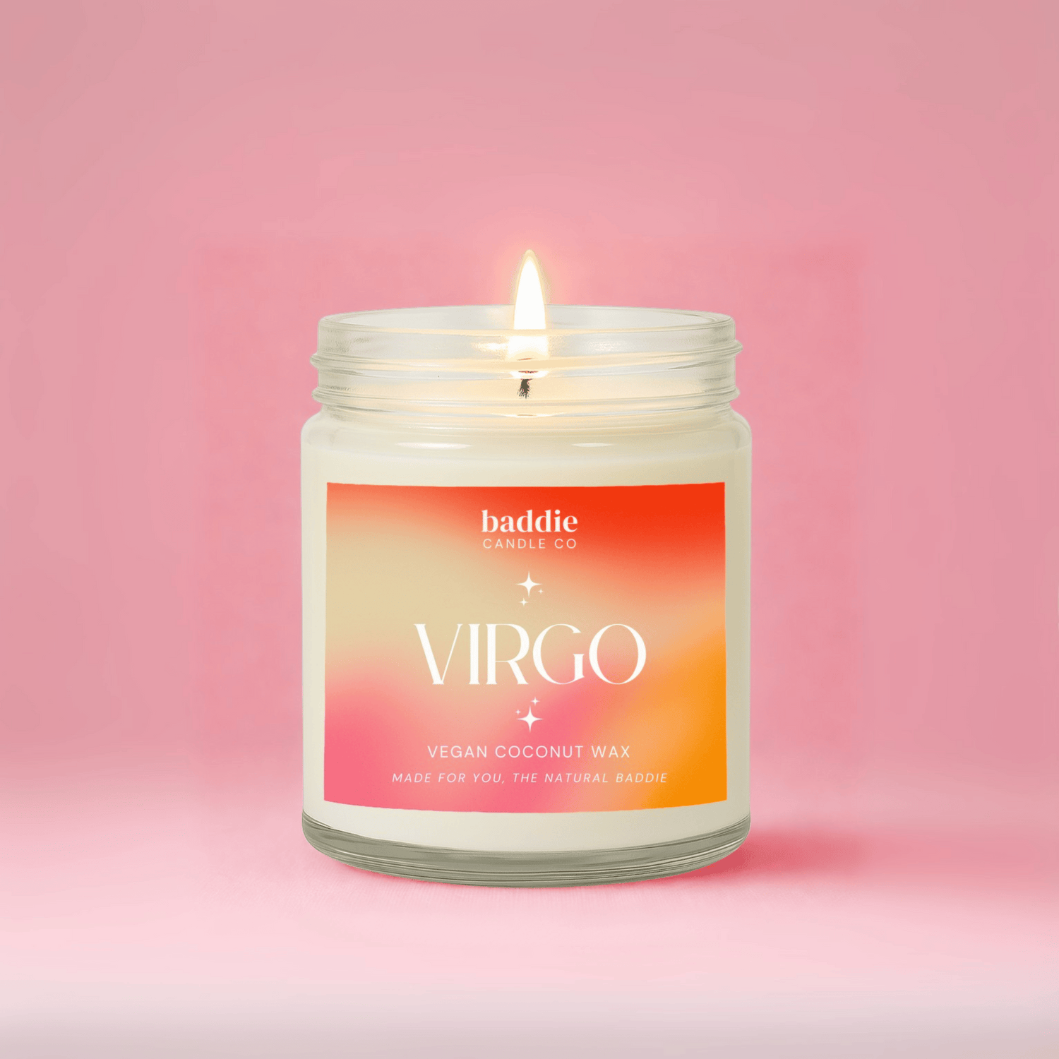 Candle in a jar with a 'Virgo' label on a pink background