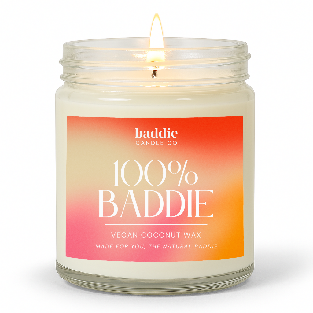Candle in a clear glass jar with a colorful gradient '100% Baddie' label with a white background
