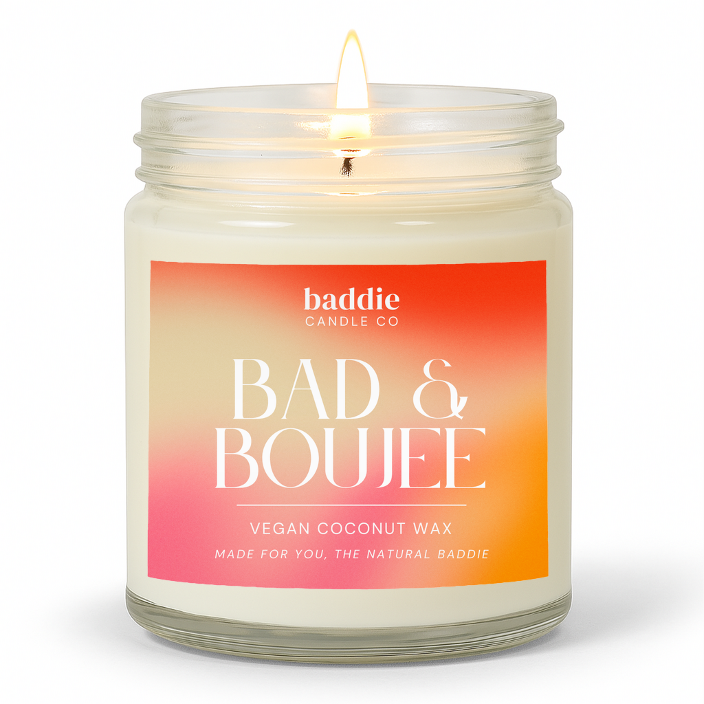Candle in a clear glass jar with a colorful gradient 'Bad & Boujee' label with a white background