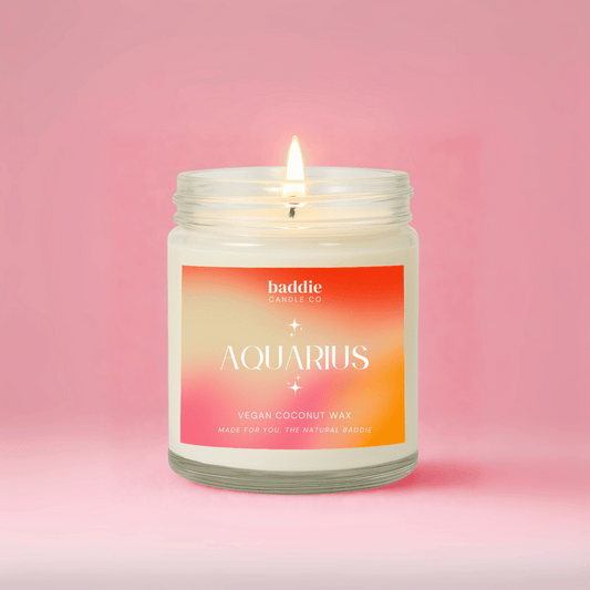 Candle with 'Aquarius' label on a pink background