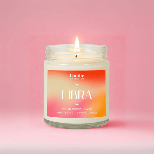 Candle with 'Libra' label on a pink background