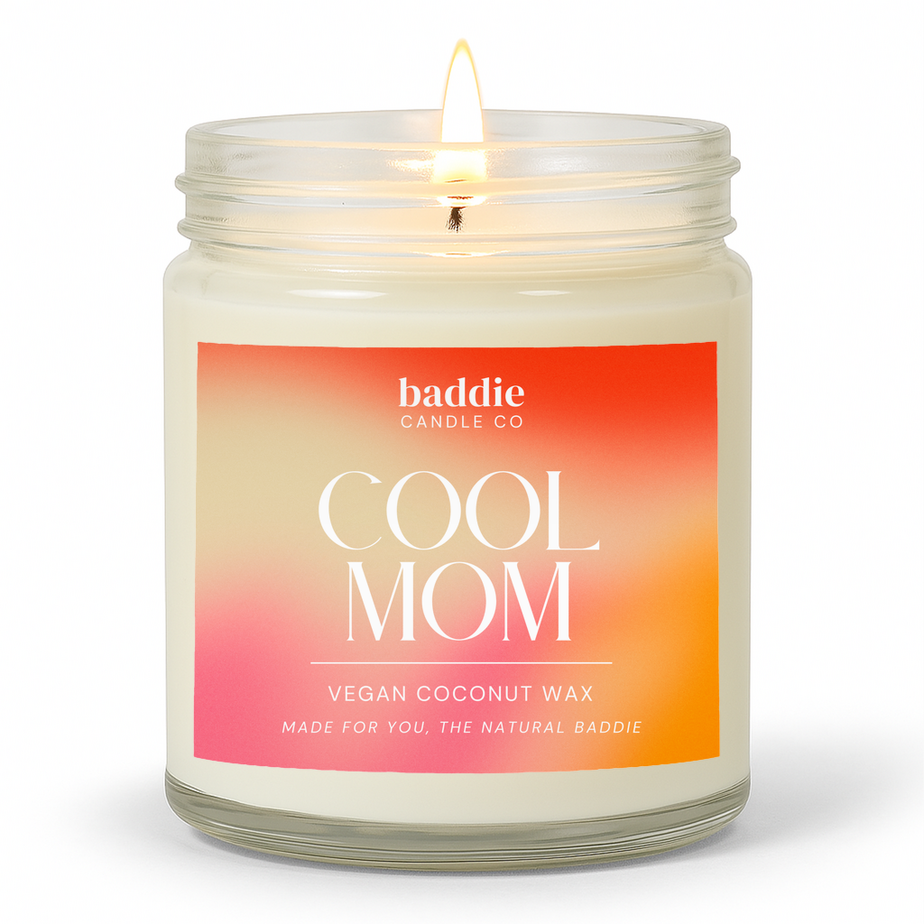 Candle in a clear glass jar with a colorful gradient 'Cool Mom' label with a white background