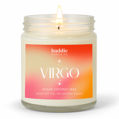 A clear jar candle with a colorful pink hued gradient label with the text, VIRGO, Vegan Coconut Wax, by Baddie Candle Co.
